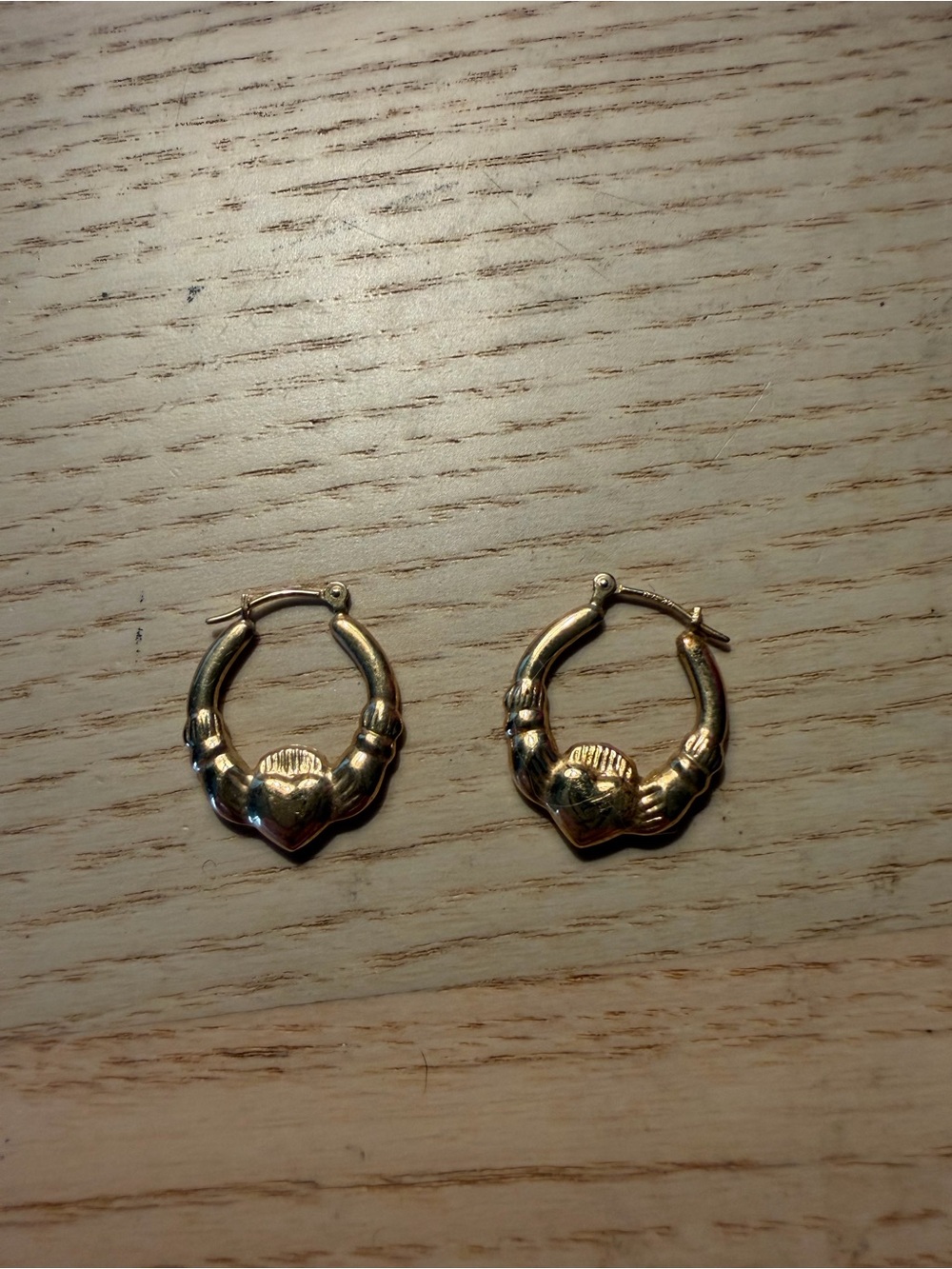 Gold tone Irish Claddagh hoop earrings